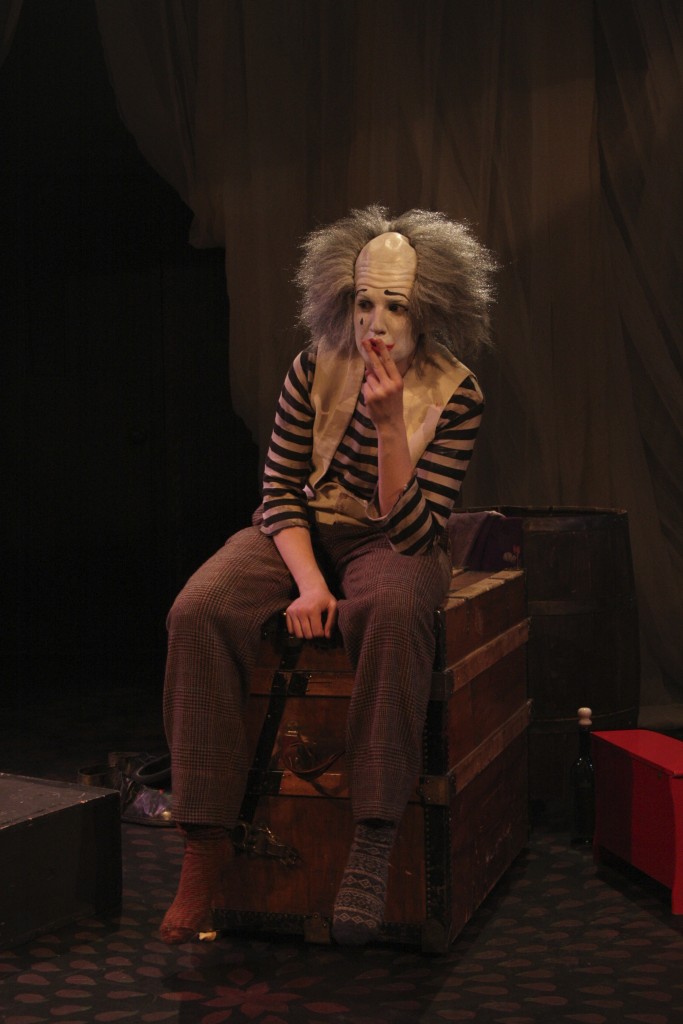 Hogue utilizing mime and a simplistic set to command her audience.